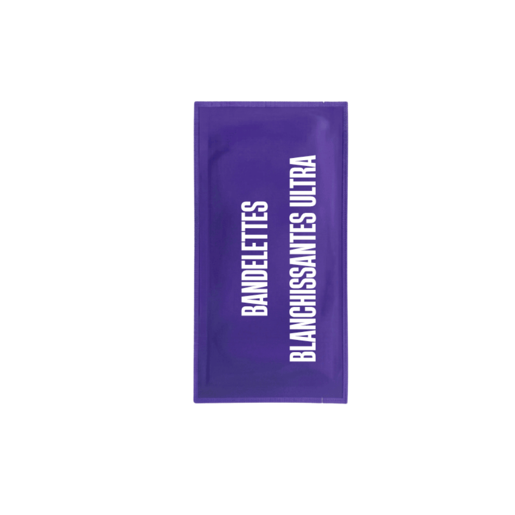 Bandelettes blanchissantes ultra emballage violet pour un sourire éclatant et soigné.