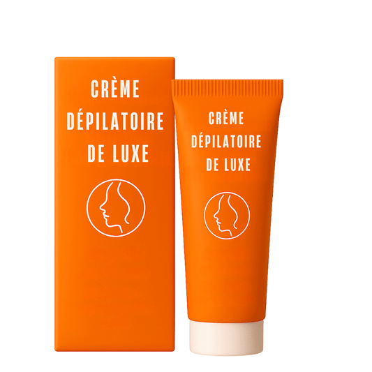 Crème dépilatoire de luxe SmoothAura avec emballage orange, conçu pour une peau soyeuse et éclatante.